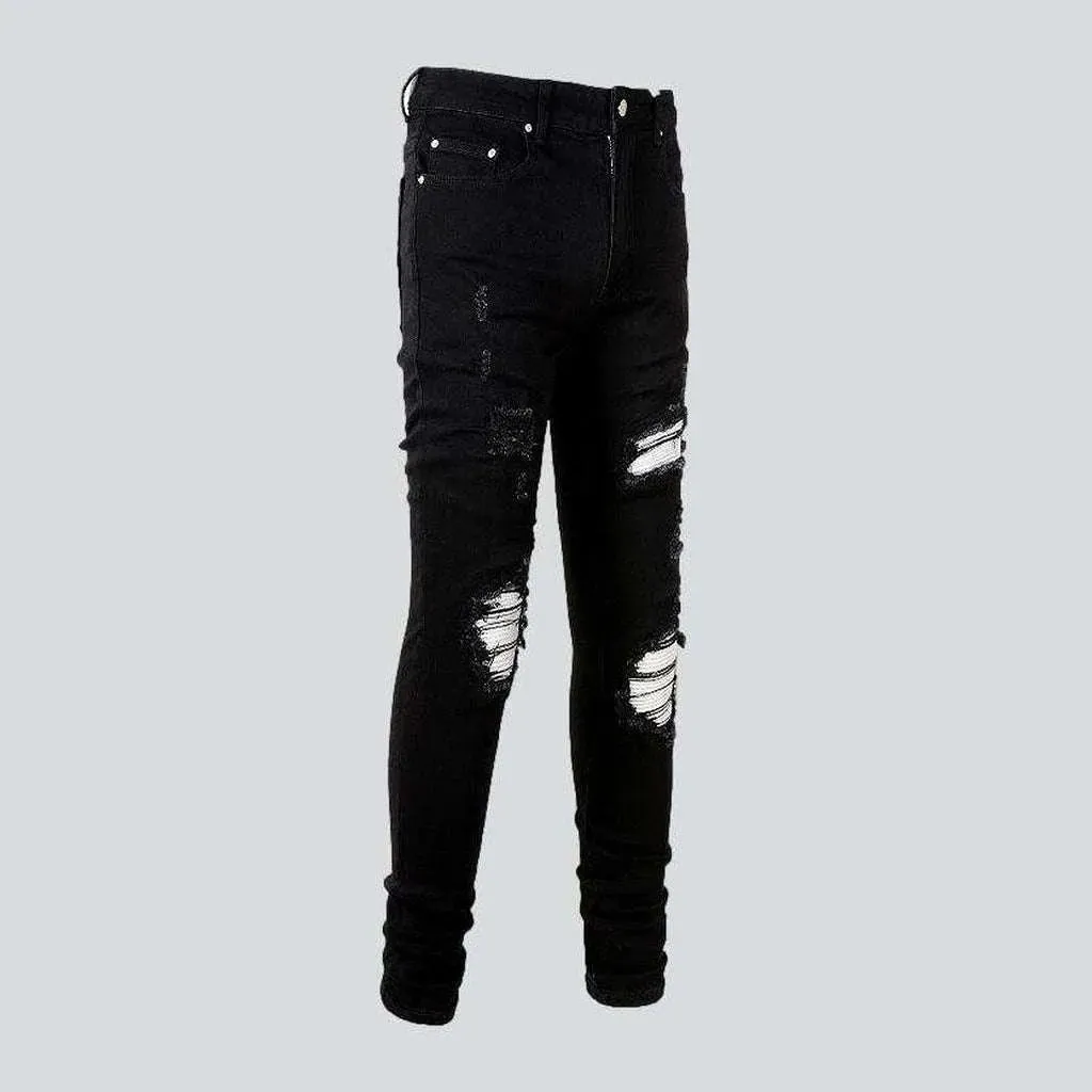 White patch ripped biker jeans